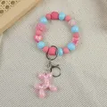 Cute pink balloon dog beaded keychain wristlet charm with blue accents and pom pom - Pink