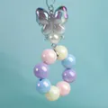 Llavero de cuentas color caramelo con mariposa iridiscente y perla para bolso - Gris Espacial