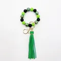 Detailed view of neon green and black beaded wristlet keychain with zebra pattern - Fluorescent Green