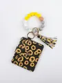 Close-up of beaded wristlet keychain with sunflower PU leather wallet and tassel - Sunflower Style