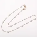 Élégante chaîne de lunettes cœur perle maillons dorés fond blanc - Style Perle Cœur (S-103) / Or