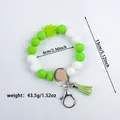Green and white silicone beaded keychain bracelet with tassel and size dimensions - Fluorescent Green