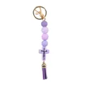 Purple silicone beaded keychain featuring a Jesus cross charm and leather tassel accessory - Lavender