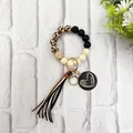 Close-up of leopard print and silicone bead wristlet keychain with Mama heart charm. - Black Style (K-1016)