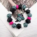Pulsera llavero artesanal de cuentas de silicona de leopardo con dije de vida de enfermera - Azul (K-1053)