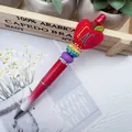 Red beaded pen featuring a Teach apple silicone topper and rainbow rhinestone ball bead - Beadable Pen / Red Beaded Pen (K-1394)
