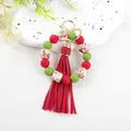 Detail showing red and green silicone beads and floral octagonal beads on a keychain - Printed Red