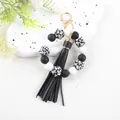 Black and white silicone bead wristlet keychain with skull patterns and a long tassel - Skull Pattern (K304)