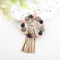 14mm silicone beaded bracelet keychain featuring leopard print beads and a gold tassel - Black Nude Leopard (K310)