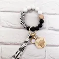 Western cow print silicone and wood beaded keychain wristlet with highland cow tag - Black and White (K-1012)
