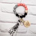 Western style silicone beaded keychain with cow print tassel and highland cow wood charm. - Lotus Root Pink (K-1012)