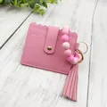 Elegant pink PU leather card holder featuring matching silicone bead bracelet and soft tassel - Bracelet Card Holder Set / Pink