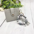 Grey PU leather card holder with silicone bead wristlet and decorative tassel charm - Bracelet Card Holder Set / Gray