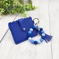 Royal blue PU leather card holder with matching blue silicone bead bracelet and tassel. - Bracelet Card Holder Set / Sapphire Blue