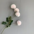 Detailed view of light pink artificial pompom mum flowers with green leaves - 10 Piece Set / White Pink