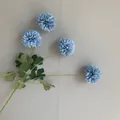Detailed look at light blue artificial ping pong chrysanthemum petals and stems - 10 Piece Set / Blue