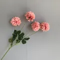 Detailed view of pink artificial pompom chrysanthemum flowers with realistic green leaves - 10 Piece Set / Dusty Pink