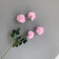 Detail view of 4-head pink artificial pompom chrysanthemum flowers against grey wall - 10 Piece Set / Pink