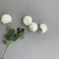 Close-up detail of 4-headed artificial white chrysanthemum with realistic green leaves - 10 Piece Set / White