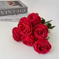 Close-up detail of 7-head artificial red rose bouquet with silk-like petal texture. - Red