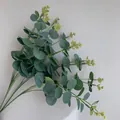 Detailed close-up of realistic 16-fork artificial eucalyptus branches with silk leaves. - 16 Branches Eucalyptus (YD202230) / Silk Screen Grey Green