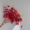 Close-up of artificial 16-fork red eucalyptus stems with yellow tips for home decor - 16 Branches Eucalyptus (YD202230) / Non-woven Wine Red