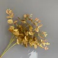 Detailed view of a 16-fork golden silk-screened artificial eucalyptus leaves bundle - 16 Branches Eucalyptus (YD202230) / Non-woven Gold
