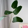 Detail view of artificial green banana leaf stem for French garden wedding decor - Monstera Leaf