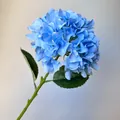 Detailed close-up of a realistic blue artificial hydrangea flower stem for wedding decor - Blue
