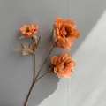 Close-up detail of orange 3-head artificial peony flower branch for nordic style wedding decor - Orange