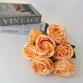 Detailed view of a 7-head artificial orange rose bouquet for elegant wedding home decor. - Yellow