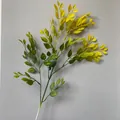 Detail view of an artificial banyan branch featuring green to yellow gradient leaves - Green Yellow