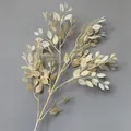 Detailed view of cream-colored artificial banyan leaf branch for elegant wedding decoration. - Light Champagne