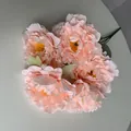 Close-up of five-head artificial peach peony bouquet with realistic layered petals - Champagne Pink