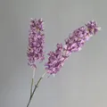 Detailed view of artificial purple hyacinth with two forks for elegant wedding decoration. - Purple