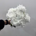 Detailed view of a hand holding a 9-head white artificial rose bouquet for decor - 9 Heads Bouquet / Pure White
