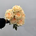 Detailed view of a handheld bouquet featuring nine creamy peach artificial silk roses - 9 Heads Bouquet / Champagne Yellow