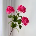 Detailed view of three-head magenta artificial hydrangea with realistic green leaves - Rose Red