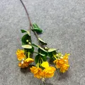 Close-up of a realistic artificial yellow jasmine flower stem with multiple heads - Jasmine / Yellow