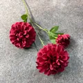 Detailed macro view of three elegant dark red silk artificial dahlia flowers for wedding - Red