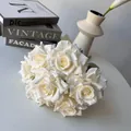 Detailed macro view of ivory white artificial silk roses for wedding and home decoration - White