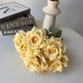 Detailed macro view of 7-head cream artificial roses for elegant home and wedding decor. - Light Yellow