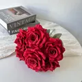 Detailed view of realistic 7-head red silk roses for home and wedding decor - Red