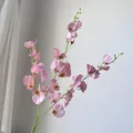 Detailed view of realistic pink artificial orchid branch for elegant home decoration. - Pink