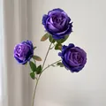 Close-up of three-headed purple artificial silk roses with realistic green leaves - 3-Head Core Rose