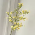 Close-up detail of yellow artificial flowers with delicate petals for garden decoration - Tall Branch Yellow Gypsophila