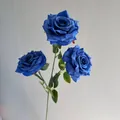 Close-up of 3-head artificial blue roses with realistic water droplets for wedding decor - Sapphire Blue