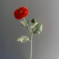 Detail view of a lifelike flocked orange Ranunculus artificial flower with a soft bud - Orange