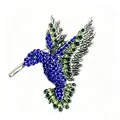 Spilla a forma di colibrì con cristalli blu e verdi e raffinati dettagli in argento - Argento Antico + Blu