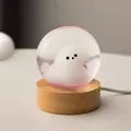 Detailed view of a cute fluffy dog character inside a glowing crystal ball night light - Cute Dog (Plug-in)